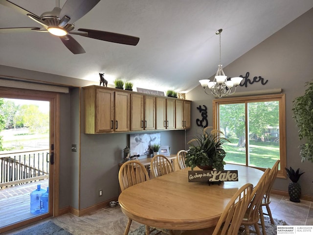 1002 Oak Ct, Plattsmouth, NE 68048 - dining space with vaulted ceiling, ceiling fan, and a chandelier