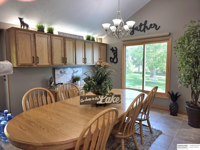 1002 Oak Ct, Plattsmouth, NE 68048 - dining space with lofted ceiling, a chandelier, and light tile patterned floors
