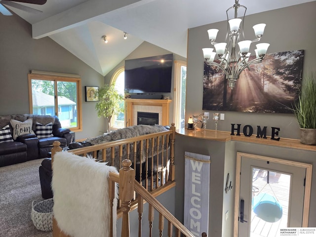 1002 Oak Ct, Plattsmouth, NE 68048 - living room with vaulted ceiling, a tiled fireplace, a chandelier, carpet floors, and ceiling fan