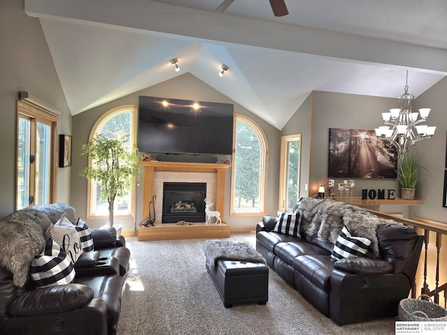 1002 Oak Ct, Plattsmouth, NE 68048 - living room featuring vaulted ceiling, a chandelier, a tiled fireplace, carpet flooring, and ceiling fan