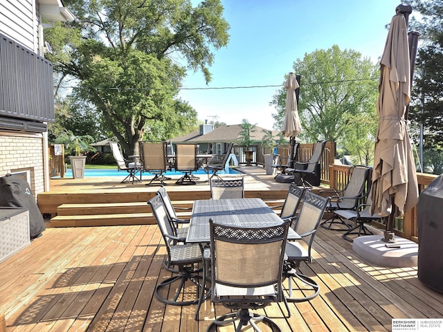 1002 Oak Ct, Plattsmouth, NE 68048 - deck featuring outdoor dining area and an outdoor pool