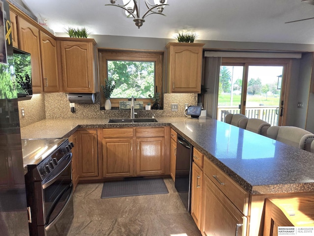 1002 Oak Ct, Plattsmouth, NE 68048 - kitchen featuring electric range, a peninsula, dishwashing machine, black microwave, and a chandelier