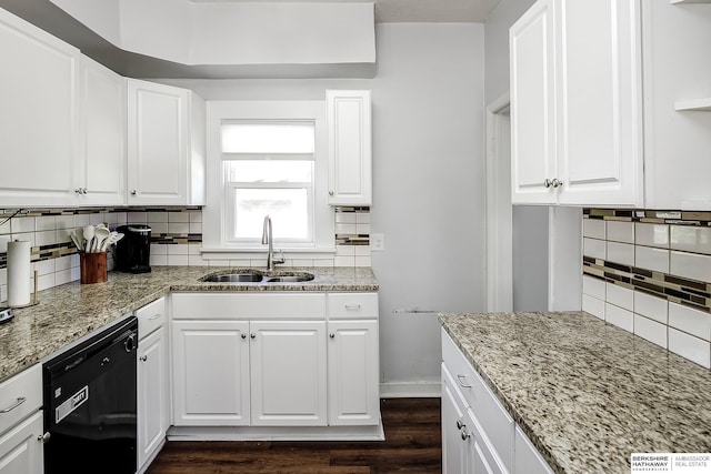 4814 Poppleton Ave, Omaha, NE 68106 - kitchen featuring black dishwasher, decorative backsplash, dark wood-type flooring, light stone countertops, and white cabinets