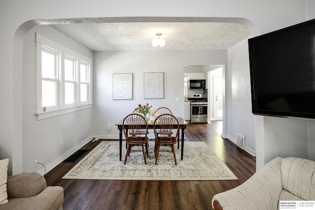 4814 Poppleton Ave, Omaha, NE 68106 - dining space with dark wood-type flooring and baseboards