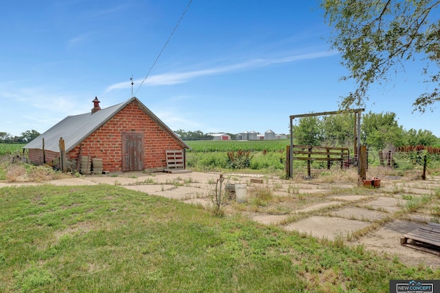 19354 SW 117th Rd, Dewitt, NE 68341 - view of side of home with a metal roof