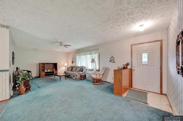 19354 SW 117th Rd, Dewitt, NE 68341 - entrance foyer with carpet floors, a ceiling fan, and a textured ceiling