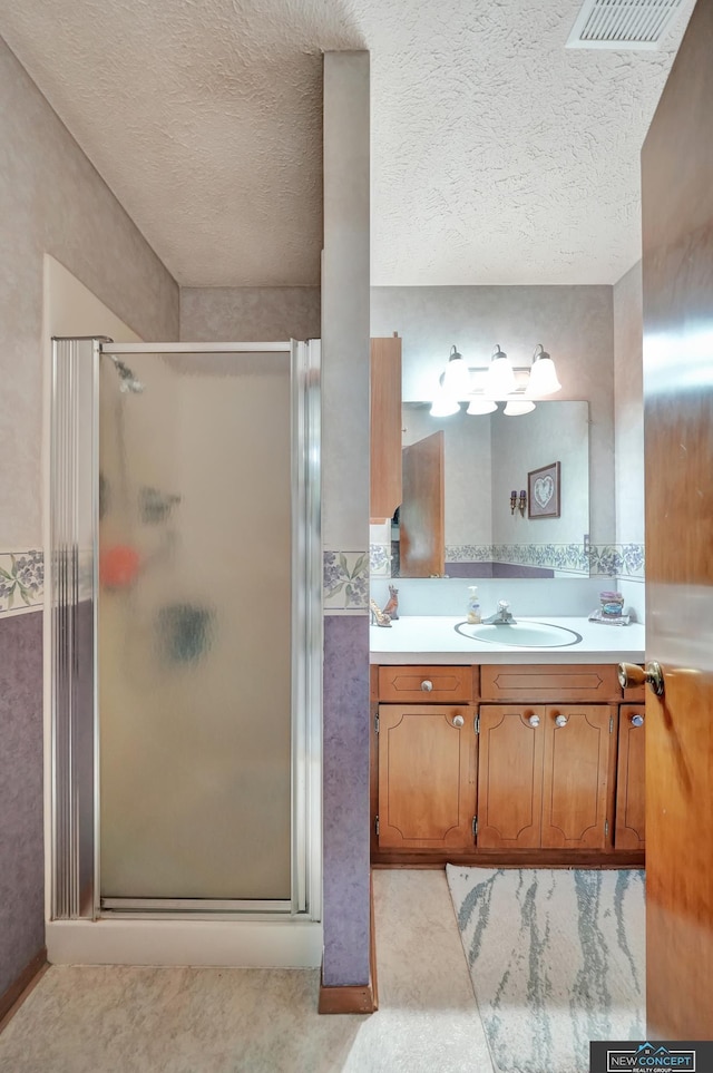 19354 SW 117th Rd, Dewitt, NE 68341 - full bathroom with a shower stall, vanity, and a textured ceiling