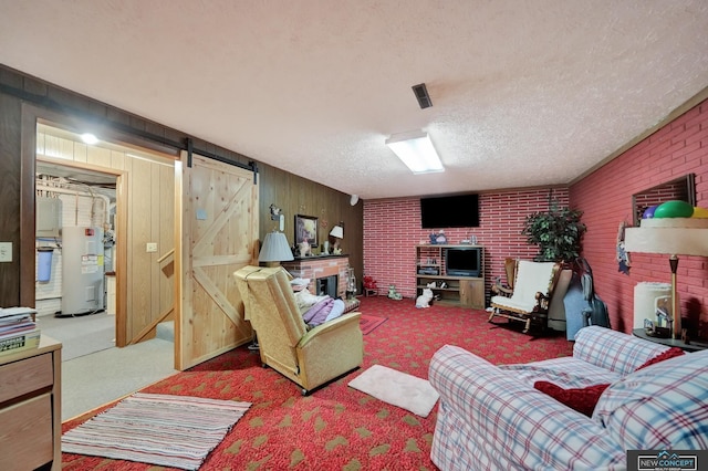 19354 SW 117th Rd, Dewitt, NE 68341 - carpeted living room with a barn door, electric water heater, a textured ceiling, wooden walls, and brick wall