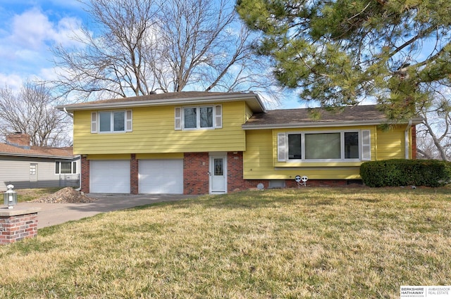 12102 Westover Rd, Omaha, NE 68154 - tri-level home featuring brick siding, an attached garage, a front lawn, and driveway