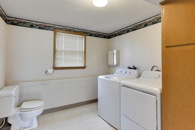 12102 Westover Rd, Omaha, NE 68154 - washroom featuring washing machine and dryer and light flooring
