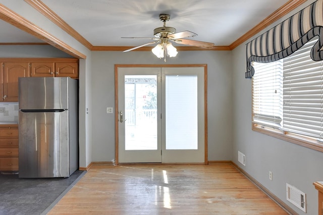 12102 Westover Rd, Omaha, NE 68154 - entryway with a ceiling fan, ornamental molding, and light wood-style flooring