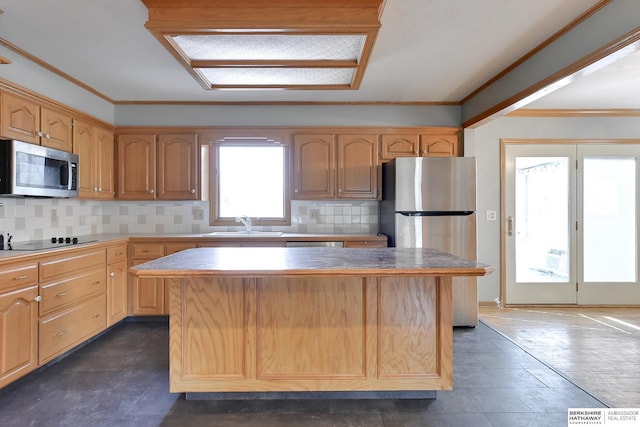 12102 Westover Rd, Omaha, NE 68154 - kitchen with stainless steel appliances, a center island, tasteful backsplash, and crown molding