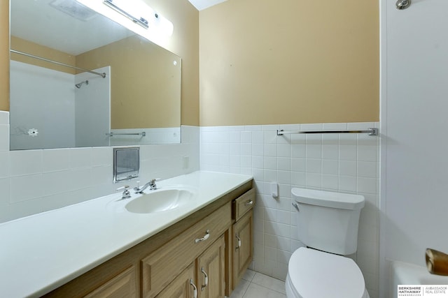 12102 Westover Rd, Omaha, NE 68154 - full bathroom featuring vanity, tile walls, tile patterned flooring, a wainscoted wall, and a shower