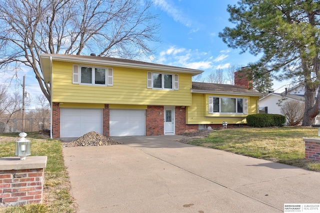 12102 Westover Rd, Omaha, NE 68154 - tri-level home featuring brick siding, an attached garage, driveway, and a chimney