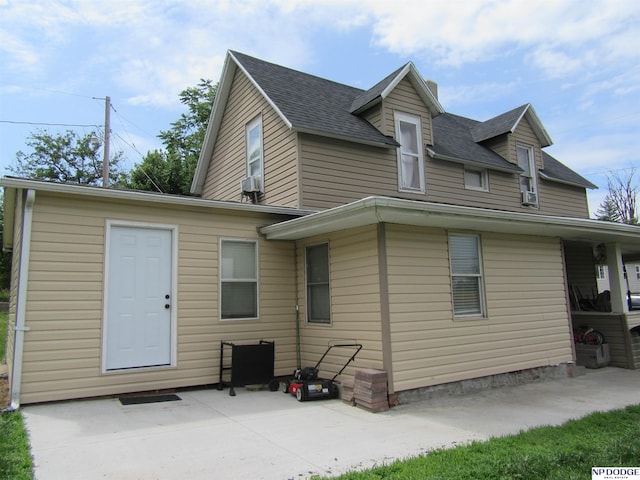 2711 Shirley St, Omaha, NE 68105 - rear view of property featuring a patio and a shingled roof