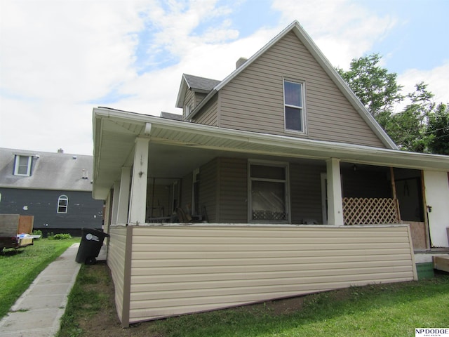 2711 Shirley St, Omaha, NE 68105 - view of side of home with a porch