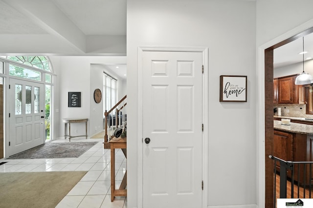 5807 S 167th Ave, Omaha, NE 68135 - entrance foyer featuring light tile patterned floors and stairs