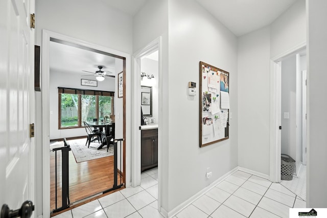 5807 S 167th Ave, Omaha, NE 68135 - hallway with light tile patterned floors and baseboards