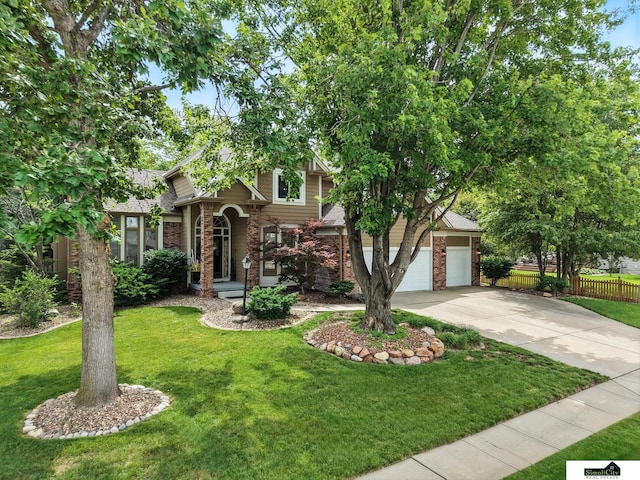 5807 S 167th Ave, Omaha, NE 68135 - view of front of house featuring brick siding, driveway, and roof with shingles