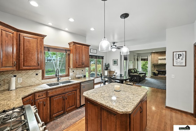 5807 S 167th Ave, Omaha, NE 68135 - kitchen with dishwasher, a center island, decorative backsplash, healthy amount of natural light, and recessed lighting