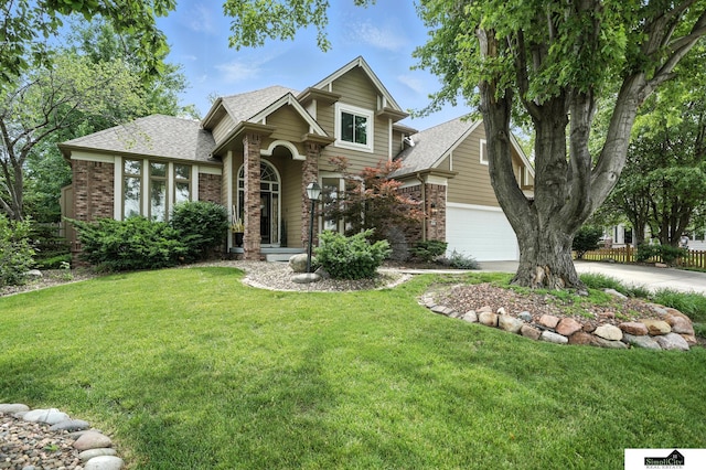 5807 S 167th Ave, Omaha, NE 68135 - view of front of home featuring brick siding, concrete driveway, and a front lawn