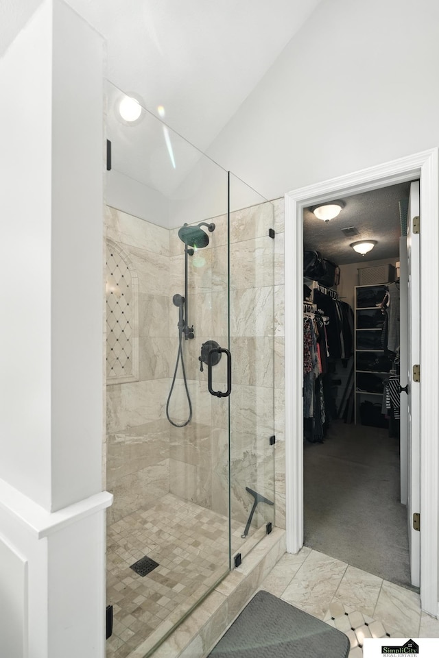 5807 S 167th Ave, Omaha, NE 68135 - full bathroom featuring a shower stall and a walk in closet