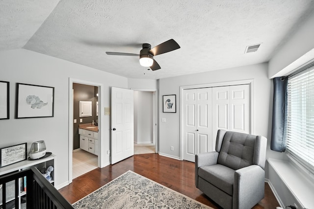 5807 S 167th Ave, Omaha, NE 68135 - sitting room with dark wood finished floors, a ceiling fan, and a textured ceiling