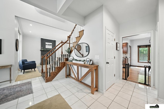 5807 S 167th Ave, Omaha, NE 68135 - entrance foyer with stairs, light tile patterned floors, and recessed lighting