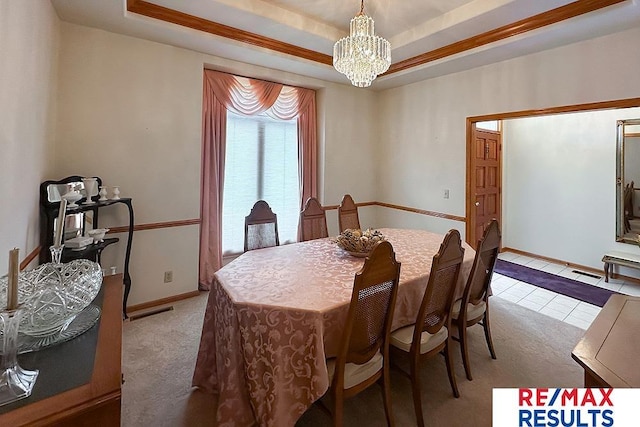 17315 M St, Omaha, NE 68135 - dining room with a chandelier, light colored carpet, and a raised ceiling