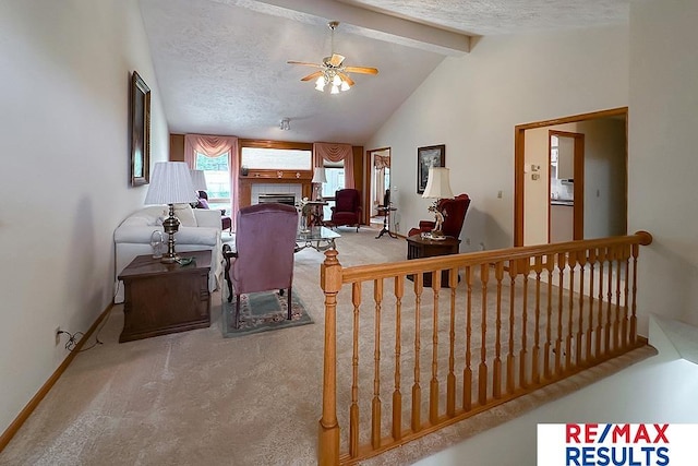 17315 M St, Omaha, NE 68135 - carpeted living room featuring a ceiling fan, a fireplace, and a textured ceiling