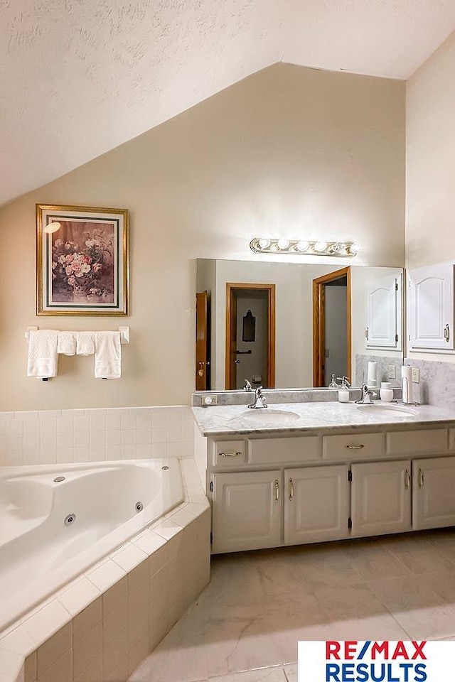 17315 M St, Omaha, NE 68135 - full bath with vaulted ceiling, double vanity, and a jetted tub