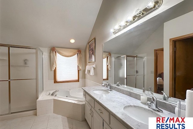 17315 M St, Omaha, NE 68135 - bathroom with vaulted ceiling, a shower stall, a tub with jets, double vanity, and tile patterned flooring