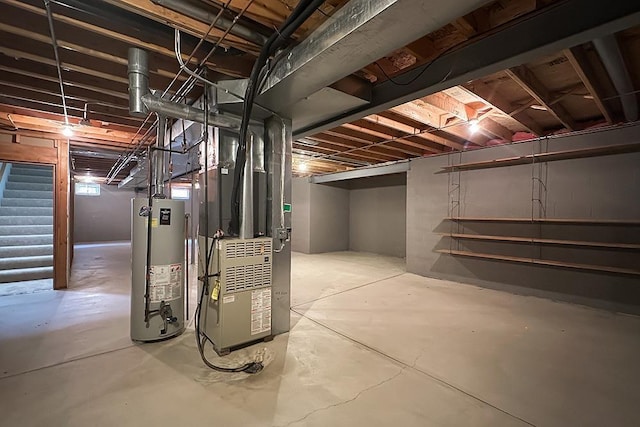 17315 M St, Omaha, NE 68135 - unfinished below grade area featuring water heater, stairway, and heating unit