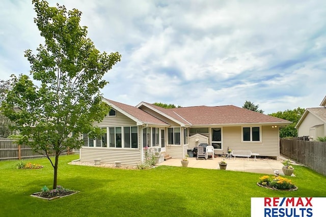 17315 M St, Omaha, NE 68135 - back of house featuring a patio area, a fenced backyard, and a sunroom