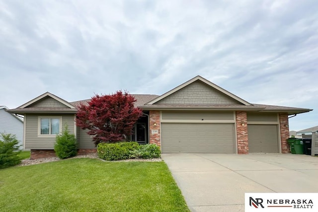 21204 Hampton Dr, Gretna, NE 68028 - view of front of property with a garage, driveway, a front yard, and brick siding