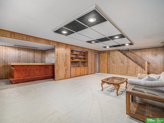 4015 Arbor St, Omaha, NE 68105 - living area featuring wooden walls, stairs, light carpet, and built in features
