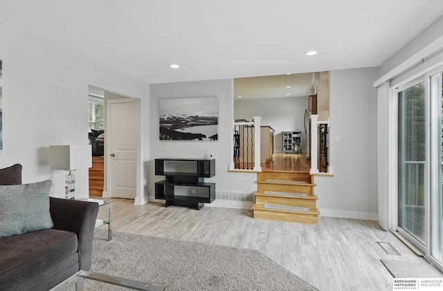 935 S 150th St, Omaha, NE 68154 - living room with light wood-style flooring, stairs, and recessed lighting