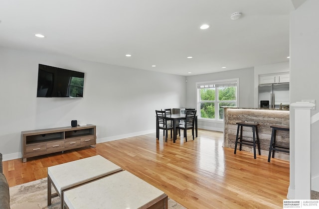 935 S 150th St, Omaha, NE 68154 - living area featuring light wood-style floors, recessed lighting, and bar