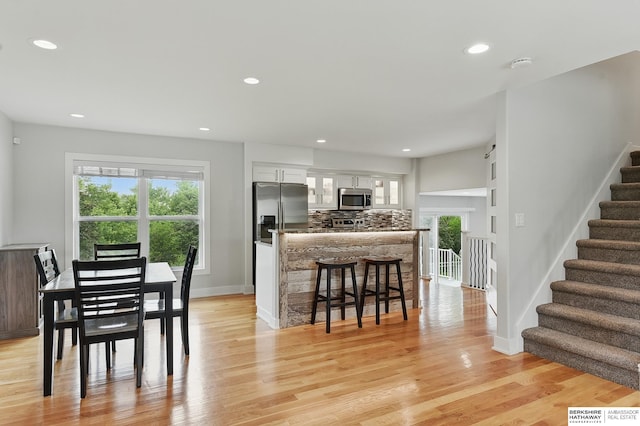 935 S 150th St, Omaha, NE 68154 - dining space featuring stairway, recessed lighting, and light wood finished floors