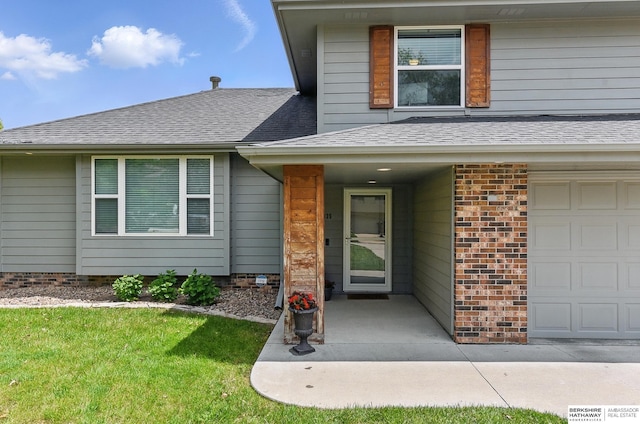 935 S 150th St, Omaha, NE 68154 - doorway to property featuring a garage, roof with shingles, and a yard