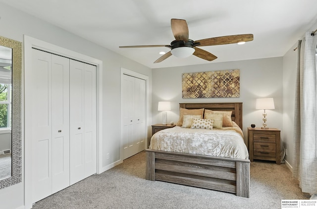 935 S 150th St, Omaha, NE 68154 - carpeted bedroom featuring two closets and ceiling fan