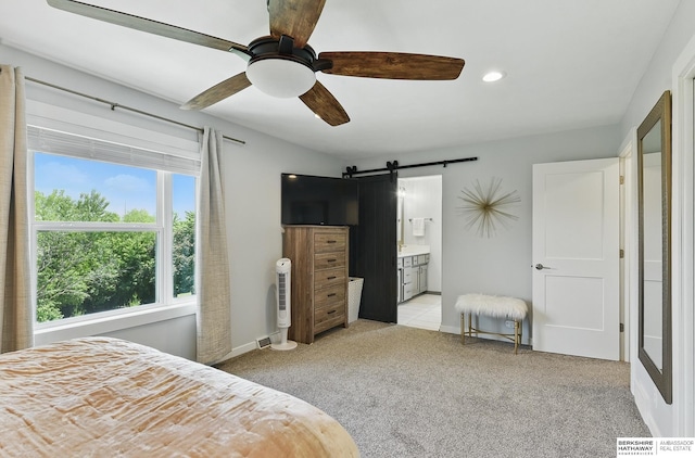 935 S 150th St, Omaha, NE 68154 - bedroom featuring a barn door, light carpet, connected bathroom, a ceiling fan, and recessed lighting
