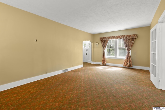 602 N 85th St, Omaha, NE 68114 - carpeted spare room featuring arched walkways and a textured ceiling