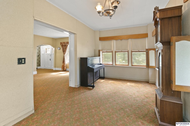 602 N 85th St, Omaha, NE 68114 - kitchen with carpet floors, a chandelier, arched walkways, and ornamental molding