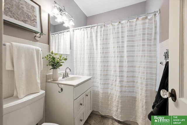 454 N 61st St, Omaha, NE 68132 - full bath featuring vanity and tile walls