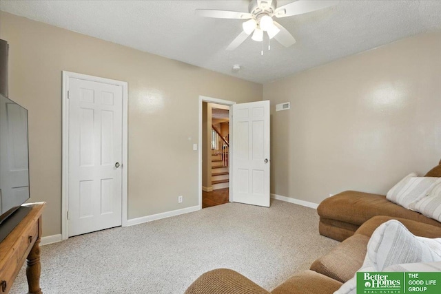 454 N 61st St, Omaha, NE 68132 - living area with a ceiling fan, carpet floors, and stairway
