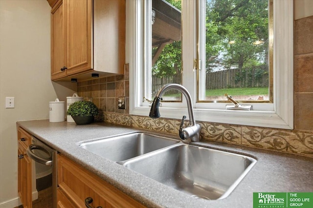 454 N 61st St, Omaha, NE 68132 - kitchen with decorative backsplash, plenty of natural light, and brown cabinetry
