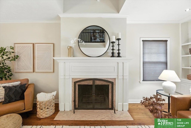454 N 61st St, Omaha, NE 68132 - living room with wood finished floors, ornamental molding, and a fireplace with flush hearth