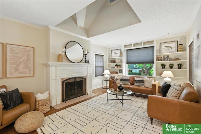 454 N 61st St, Omaha, NE 68132 - living room featuring built in features, crown molding, a fireplace with flush hearth, and light wood finished floors
