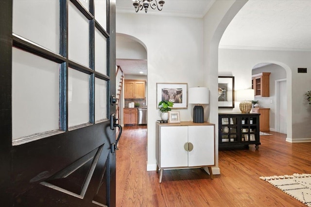 454 N 61st St, Omaha, NE 68132 - foyer entrance with ornamental molding, wood finished floors, and arched walkways